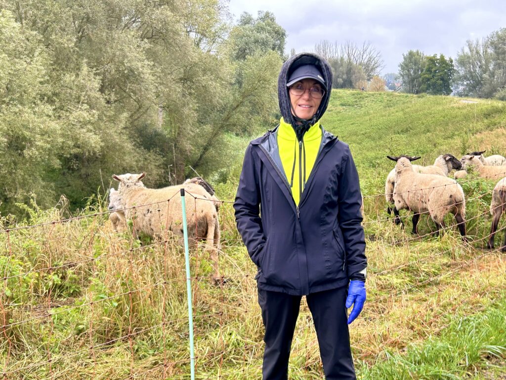 Female traveler in sportswear on a rainy day