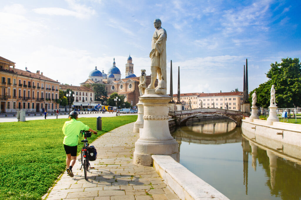 Cyclist near the Prato della Valle and basilica, Padova