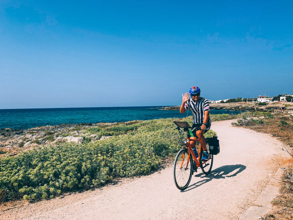Cyclist on a coastal path, Salento, Puglia